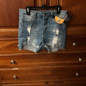 NWT fabulous distressed denim shorts. Cuffed front legs. 4 pockets.